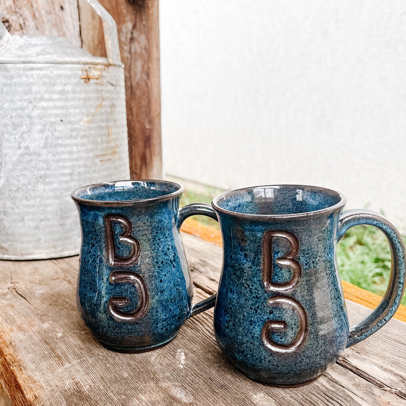 A mug with a cattle brand carved into it by hand