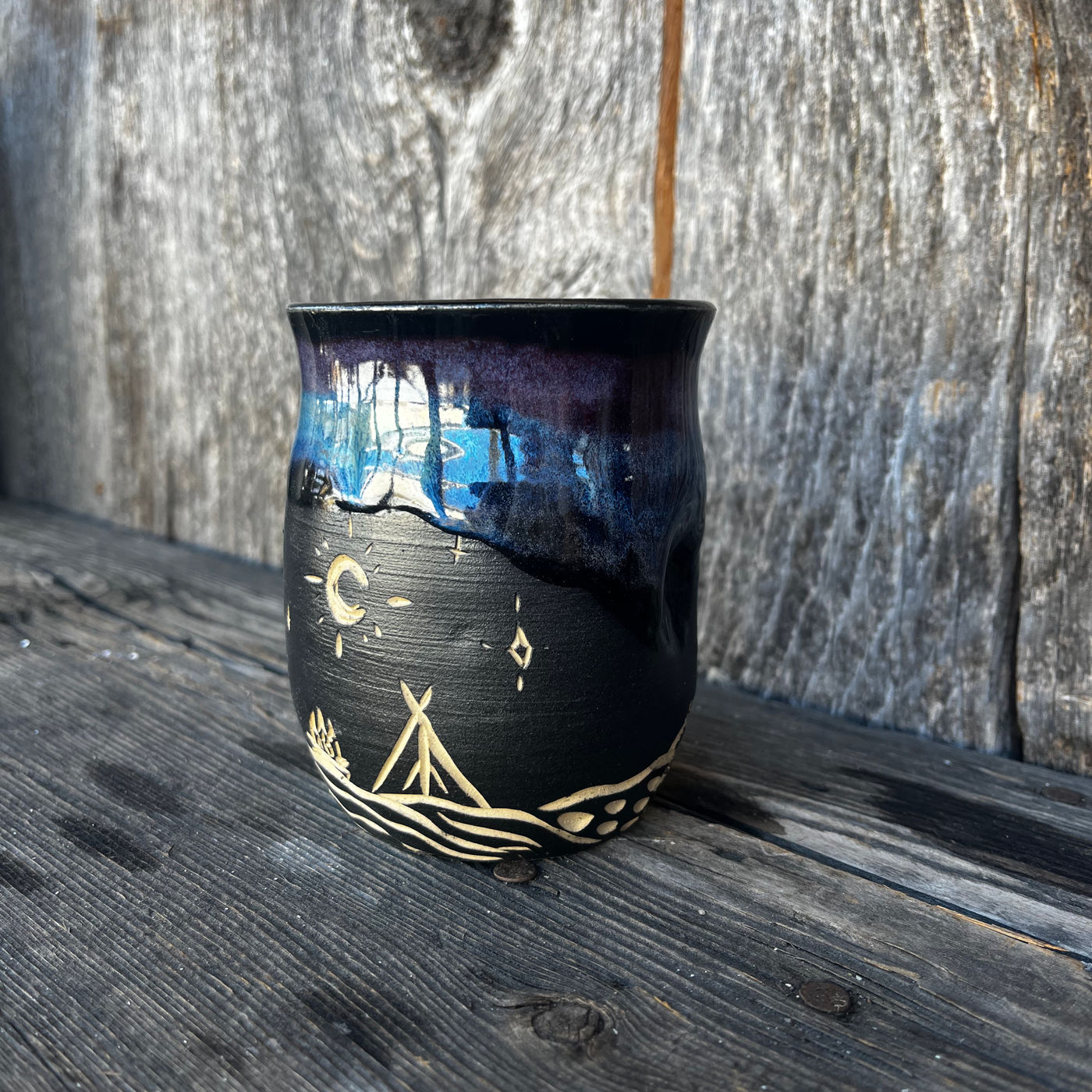 A finished mug in one of Dellaney's glazes